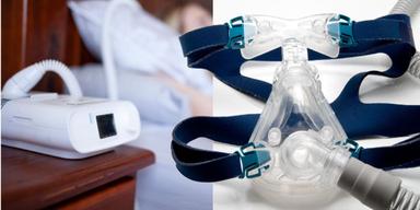 En kvinna ligger i sängen med en SPAP-maskin och en CPAP-maskin